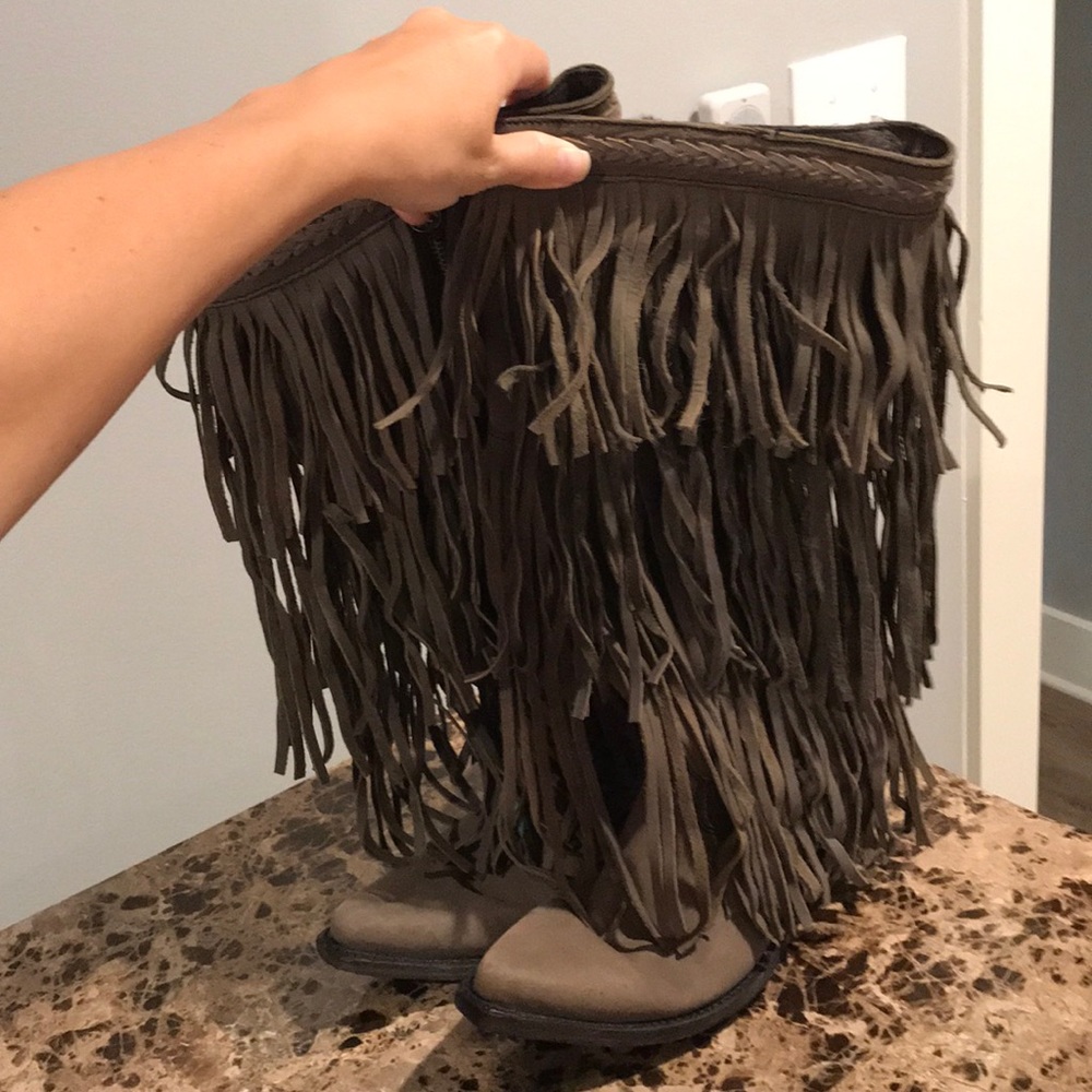 Like new leather fringe boots.